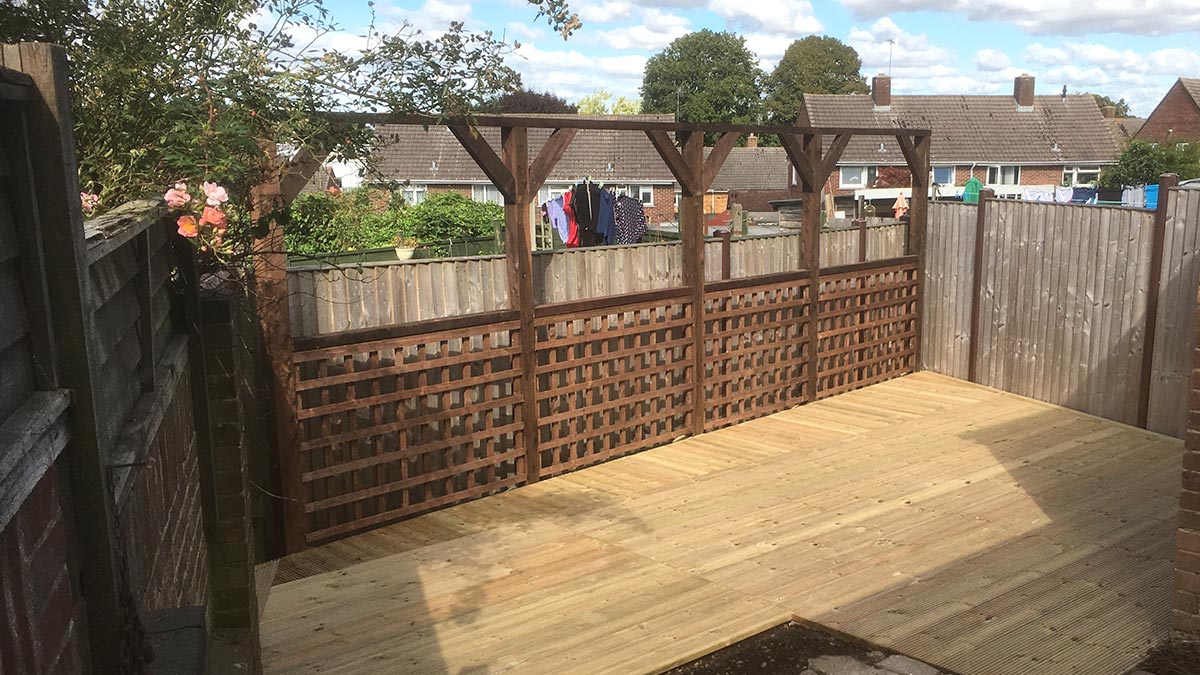 Decking completed, with Trellis and pergola in a back garden in Winchester