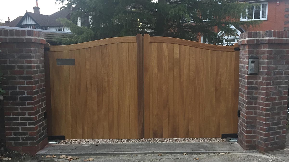 Hardwood automatic driveway gates with swan-neck design in hardwood, Chandlers Ford