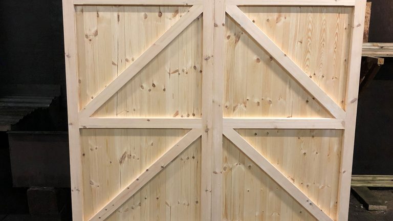 A pair of domed matchboard gates in softwood ready for finishing A pair of domed matchboard gates in softwood ready for finishing