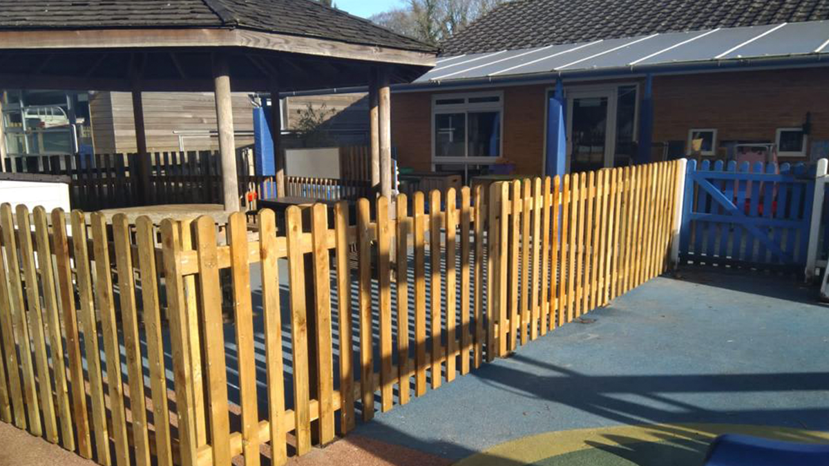Face-fixed timber palisade fence at school - Winchester