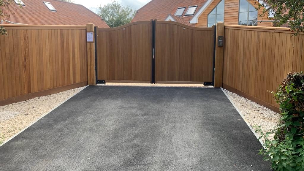 Automated Iroko hardwood gates and panels – installed in Romsey Automated Iroko hardwood gates and panels - installed in Romsey