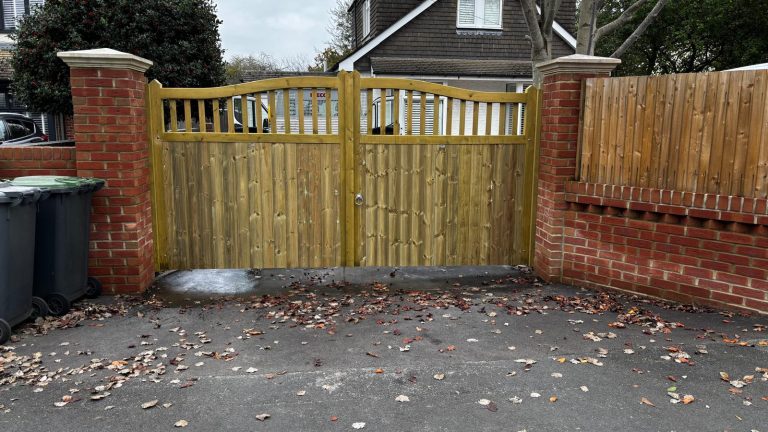 Softwood swan-necked gates with spindles installed in Southampton